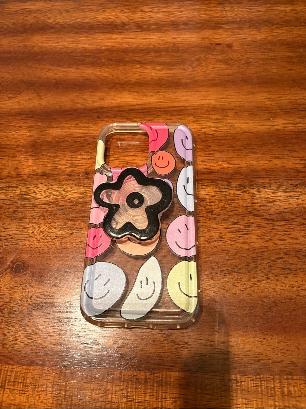 iPhone 15 plus Clear Multi-Color Smiley Flower Phone Case with Black Pop Grip